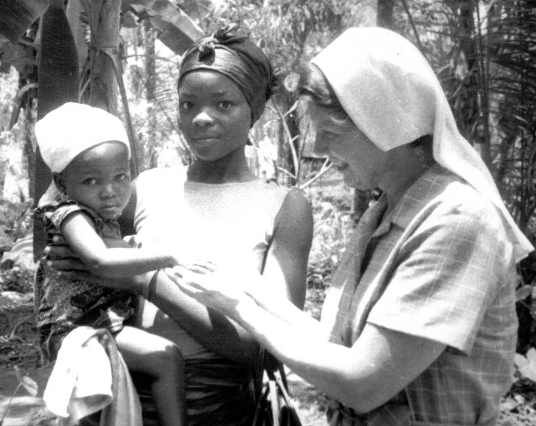 Sister Melmarie Gentry is greeting a mother and child in Nigeria in 1974.