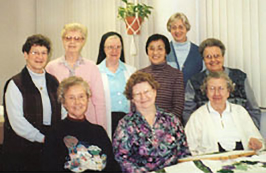 The Liturgical Fabric Arts Dept. (row 1, l to r) Sisters Mary Ann Giese, Rita Maureen Deimeke, Henriette Hoene, (second row, l to r) Frances Ann Eveler, LaVerne Kleinheider, Marie Virginia Strubhart, Regina Kabayama, Josephine Niemann, and Mary Avila Markiewicz