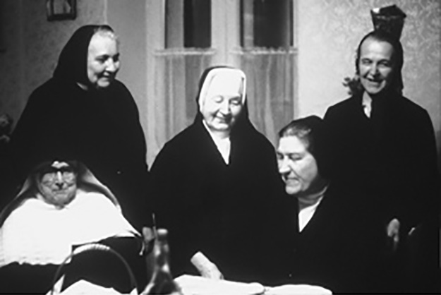 Sister Amabilis (seated at right) visits with Sisters living under communism.