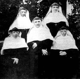 The original picture of the five pioneer sisters. The pioneers were, from left to right, as follows: Front row: Mother Seraphine, Mother Caroline, Sister Emmanuel, Mistress of Novices. Back row: Mother Theophila, Sister Seraphica. (From Mother Caroline and the School Sisters of Notre Dame by Sister Dymphna Flynn, 1928).